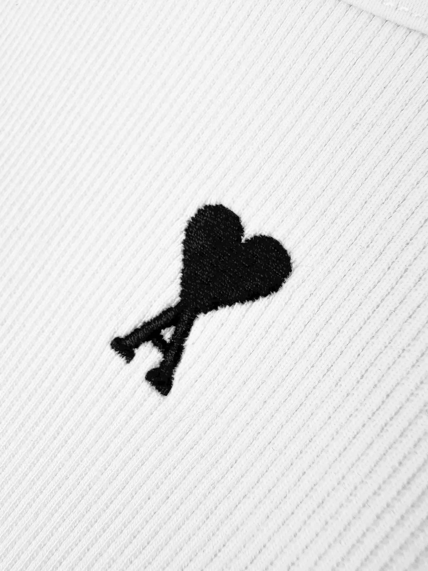 Logo embroidered vest Customized luxurious and soft plain cotton, cloud-like and skin-friendly, refreshing Breathable to pure white tones embody French elegance, showing a luxurious style when relaxed. The love logo on the front is lightly embroidered in black. The back collar has ami embroidery with dark engraved texture. French attitude on both sides. Minimalistic and quality. Hidden charm inside. Wear it casually alone. Versatile is elegant and effortless. Process 1: Use imported machine embroidery technology. Use advanced computer control systems and precision mechanical components to achieve Ami logo and letter embroidery operations with high precision and smooth and delicate lines. Process 2: The fabrics have been fermented and washed for a better hand feel. Not easy to deform, not easy to shrink, not easy to fade, and maintain long-term beauty. Accessories: Customized 1:1 Ami trademark. Version: Fitted version. Size: S M L XL. Style number: AA 603.